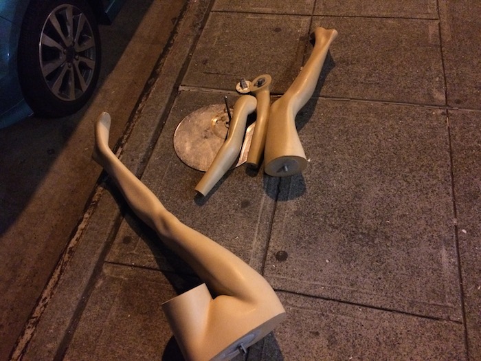 Pieces of a mannequin on a stage.